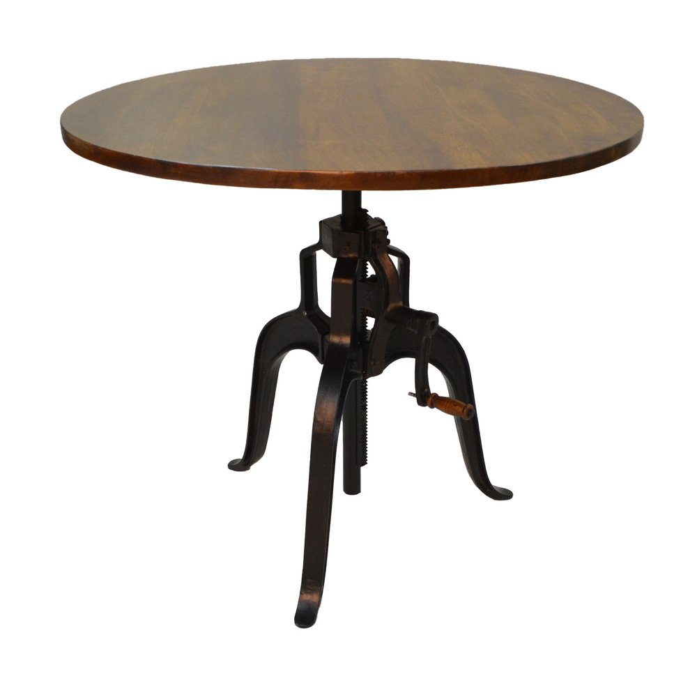Round brown wood top dining table with adjustable height black iron pedestal base and crank.