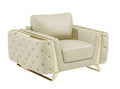 Beige genuine leather tufted club chair with gold metal accents on a white background.