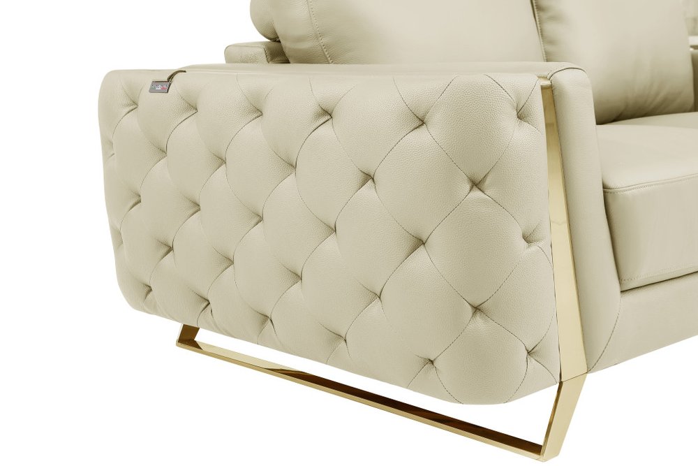 50" Beige And Gold Genuine Leather Tufted Club Chair. Accent chair isolated on a plain white background, finished in beige leather.