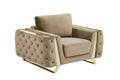 Beige velvet tufted club chair with gold metal accents and legs on a white background.