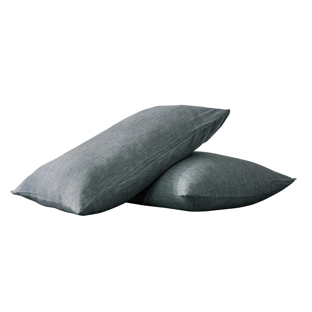Two slate gray linen pillowcases are stacked diagonally on a white background.