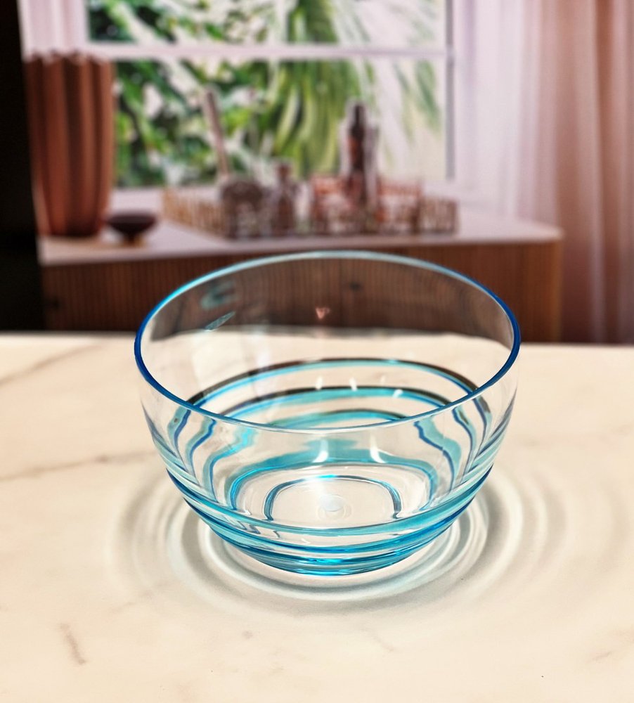 Clear and Blue Four Piece Swirl Acrylic Service For Four Bowl Set in a home interior