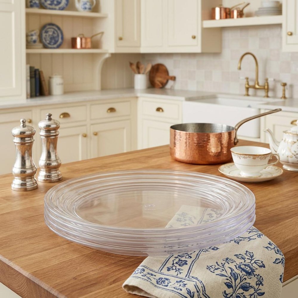 Clear Four Piece Round Swirl Acrylic Service For Four Salad Plate Set in a home interior