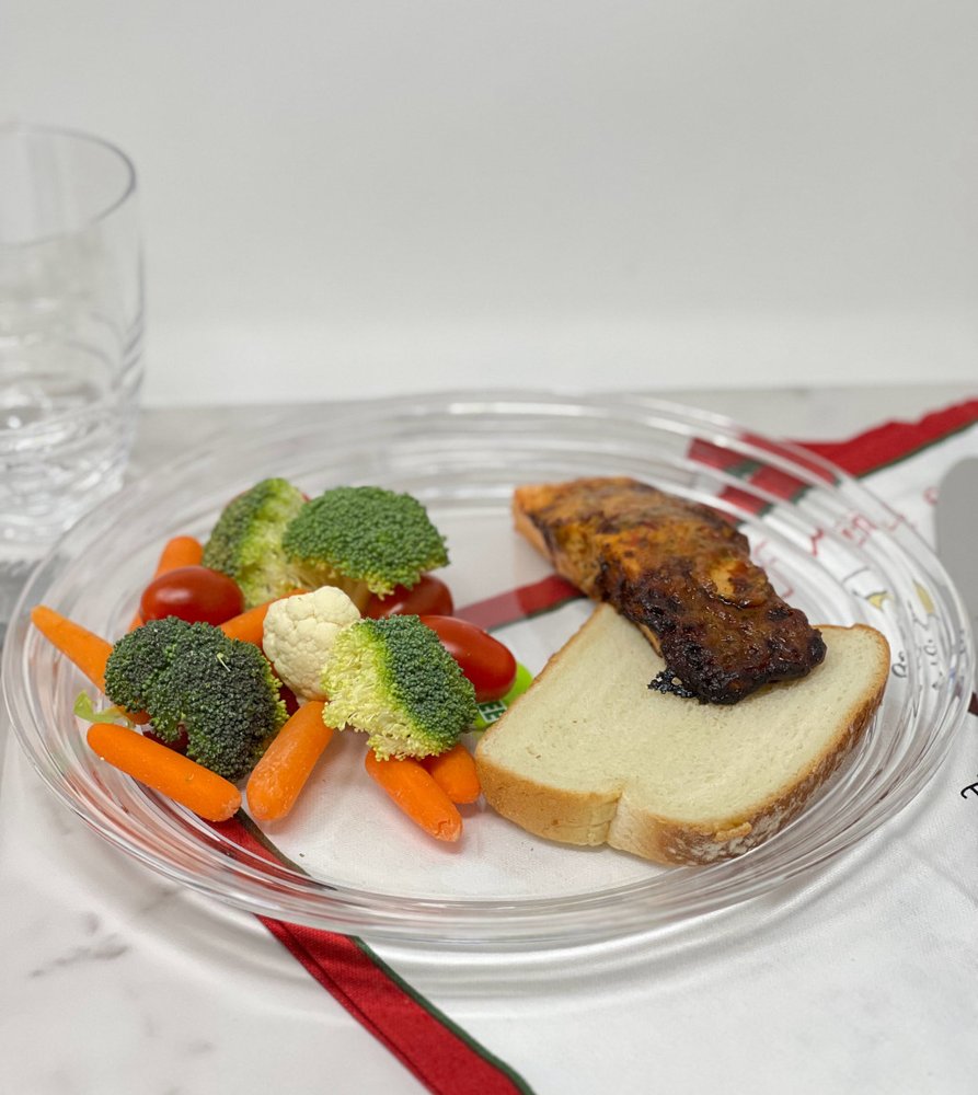 Clear Four Piece Round Swirl Acrylic Service For Four Dinner Plate Set on a white background