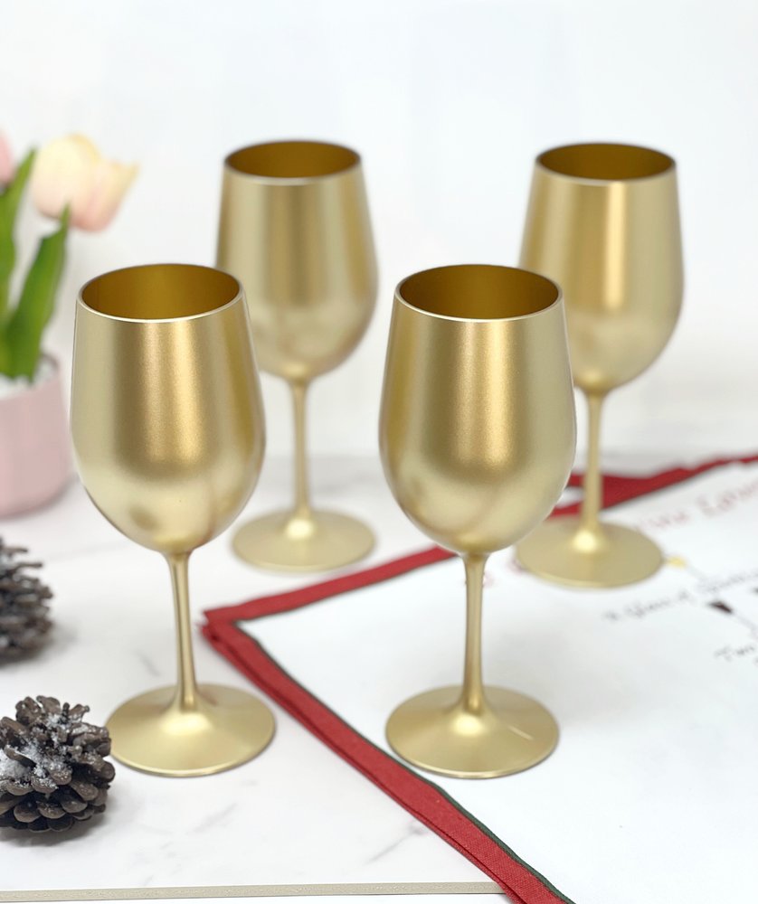 Set of Four Gold Acrylic Stemmed All Purpose Wine Glasses on a white background
