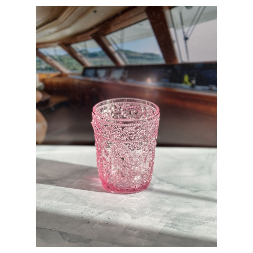 Set of Four Pink Paisley Acrylic Stemless Whiskey Glasses on a white background