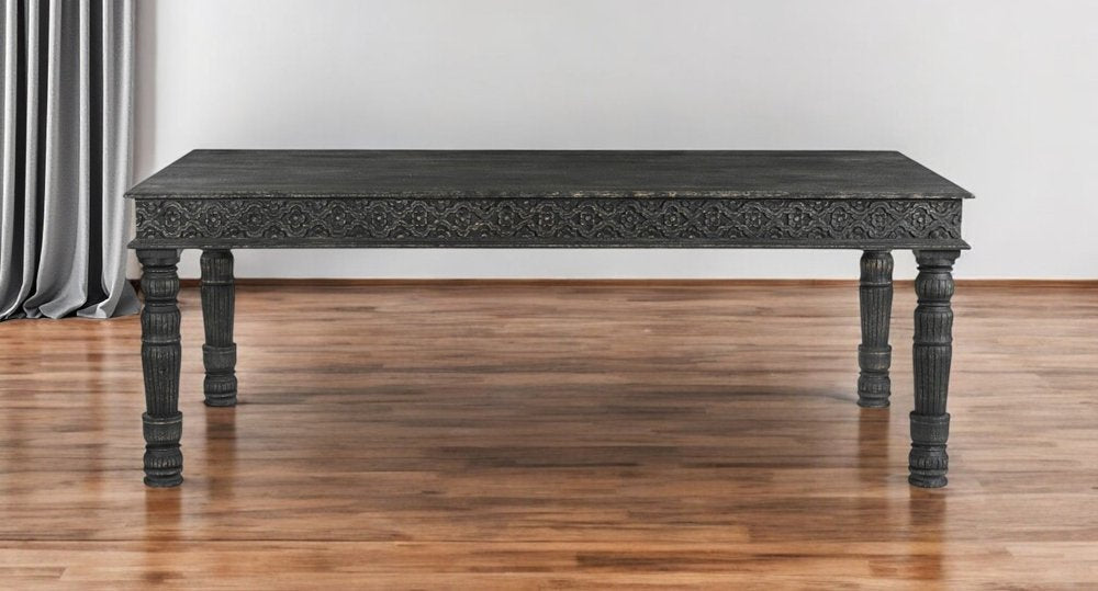 84" Black Solid Wood Dining Table in a home interior