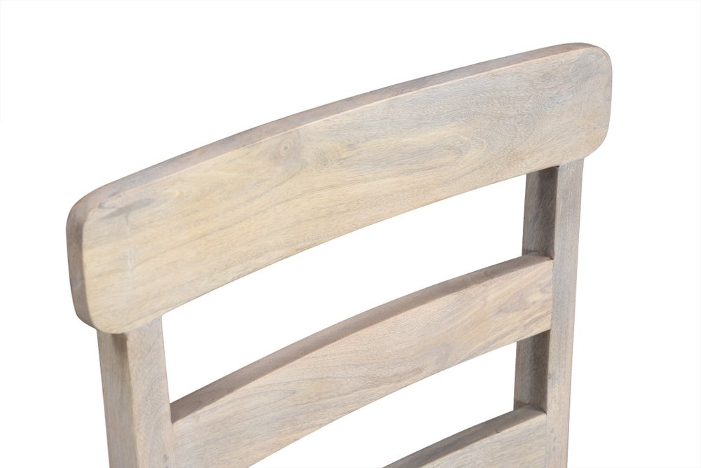 Close-up of the top of a white wood ladder back dining chair against a white background.
