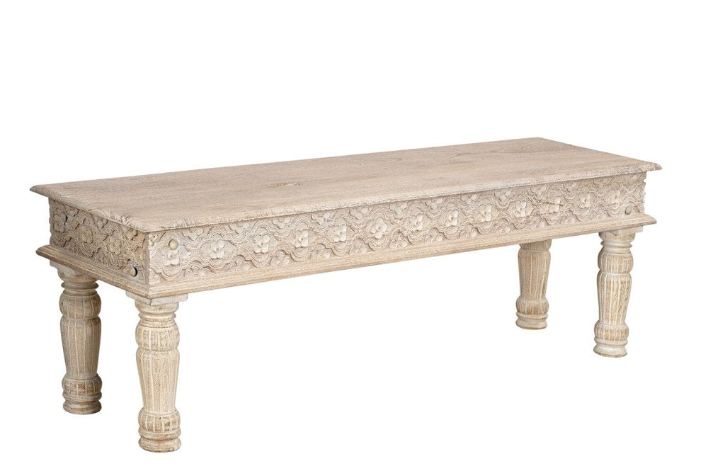 A white distressed solid wood dining bench with carved floral details on a white background.