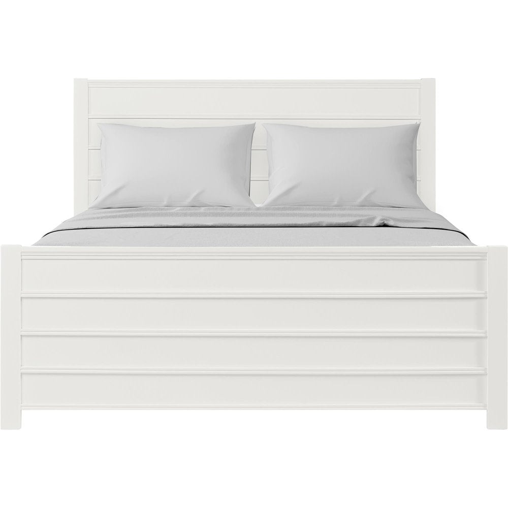 White solid wood queen bed frame with shiplap texture on the headboard and footboard, featuring two gray pillows and bedding.