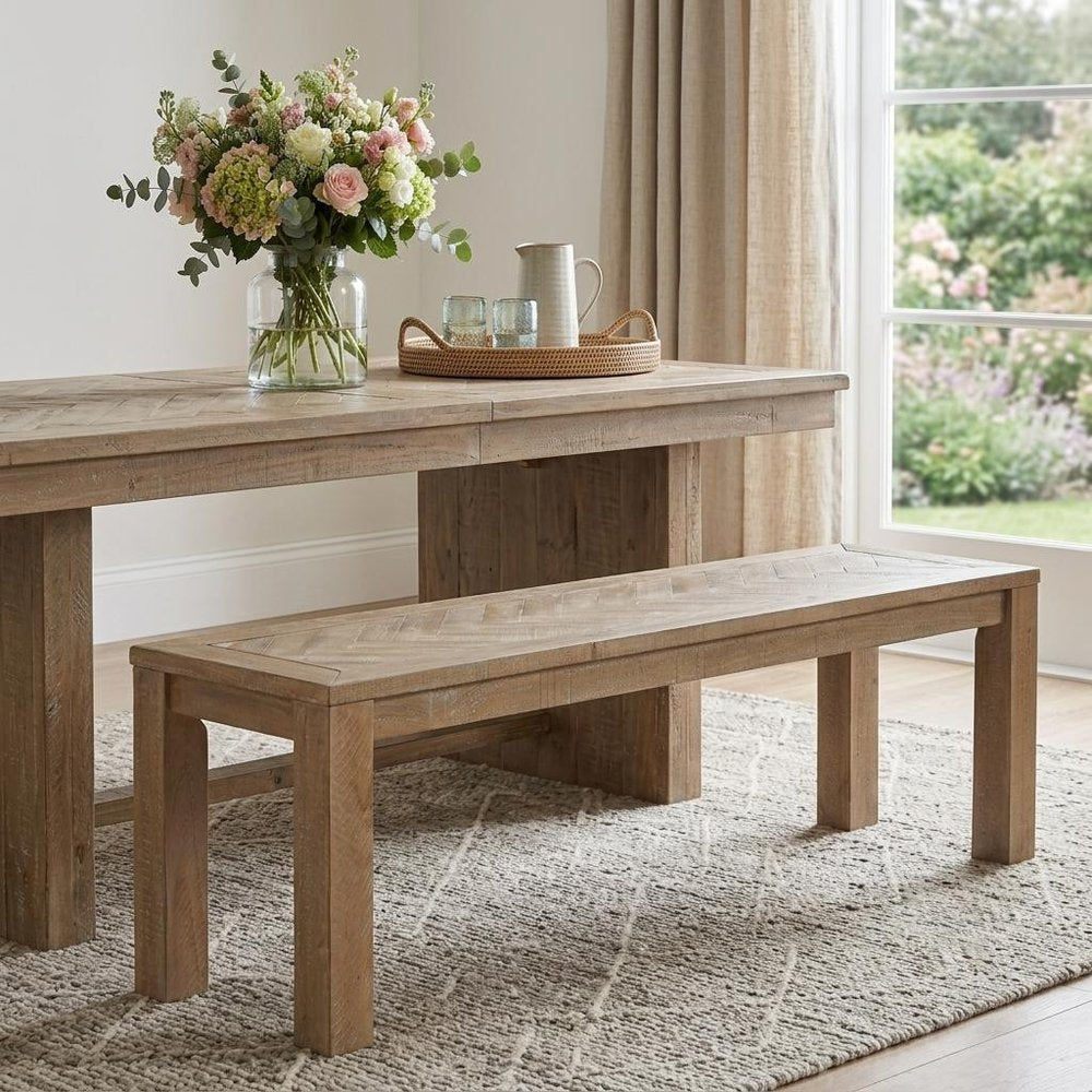 60" Natural Distressed Solid Wood Dining Bench styled in a furnished interior with a tan wall on a wood floor in tan wood.