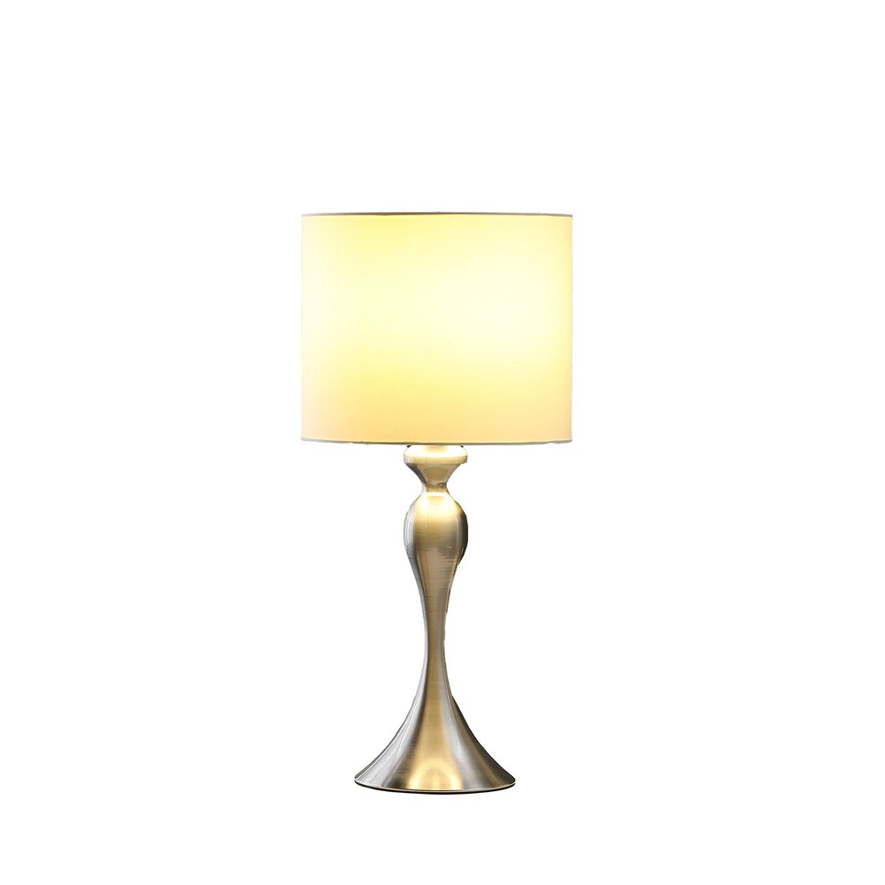 25" Silver Metal Table Lamp With Off White Drum Shade. Table lamp isolated on a plain white background, finished in off-white metal.