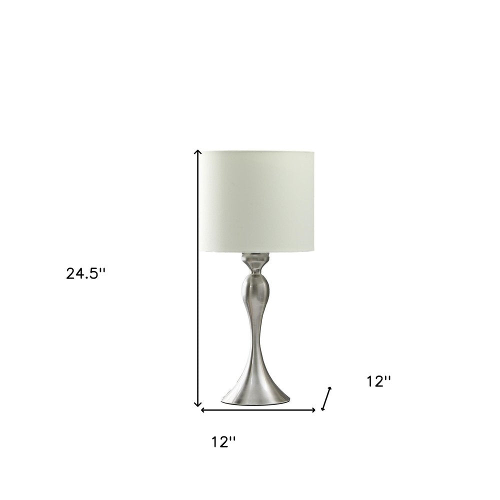 25" Silver Metal Table Lamp With Off White Drum Shade. Table lamp isolated on a plain white background, showing a off-white metal surface.