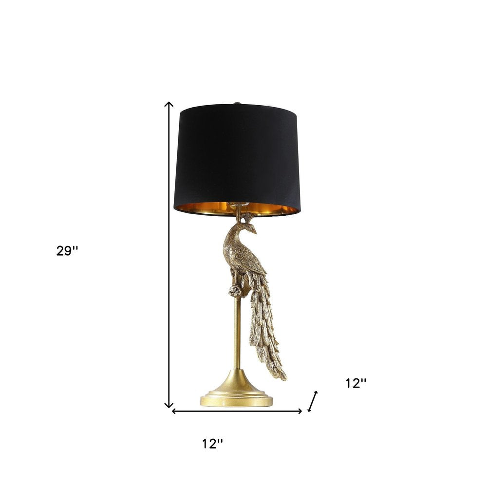 29" Gold Peacock Table Lamp With Black Drum Shade. Table lamp isolated on a plain white background, in a gold finish.