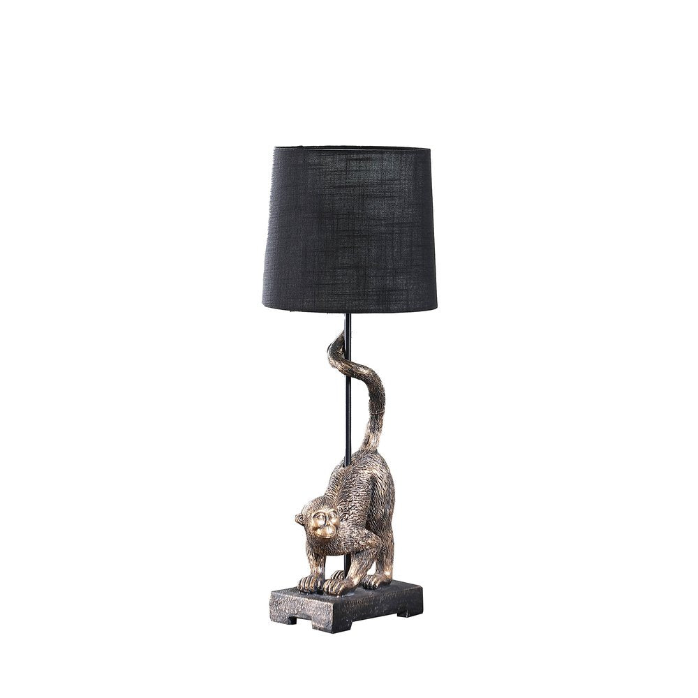 24" Antiqued Gold Monkey Table Lamp With Black Drum Shade. Table lamp isolated on a plain white background, finished in black.