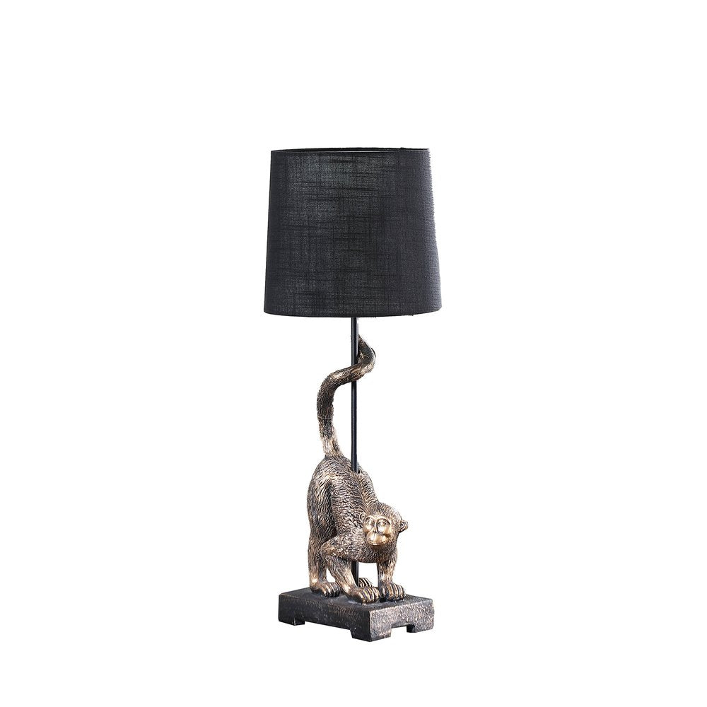 24" Antiqued Gold Monkey Table Lamp With Black Drum Shade. Table lamp isolated on a plain white background, showing its gold color.