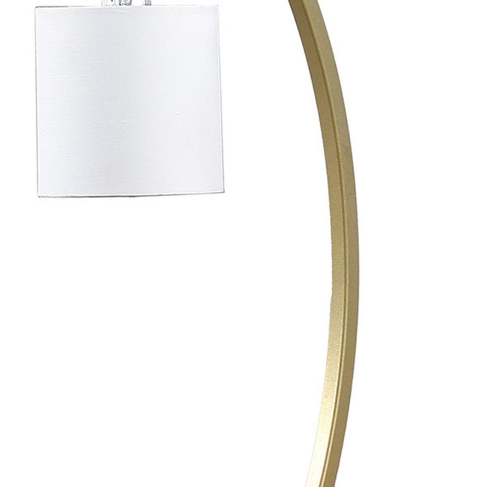 29" Gold Metal Two Light Arched Table Lamp With White Drum Shade. Table lamp isolated on a plain white background, in a gold metal finish.