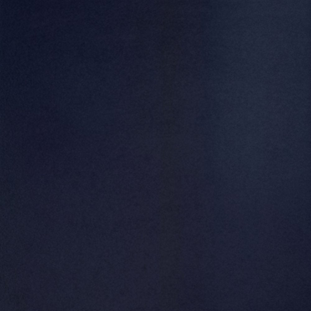 Detail view of 28" Navy Blue Geometric Table Lamp With Drum Shade, filling the frame with the navy texture.