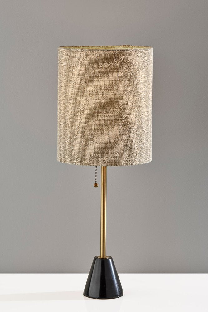 Detail view of 28" Black and Gold Marble and Metal Table Lamp With Beige Drum Shade, filling the frame with the beige metal texture.