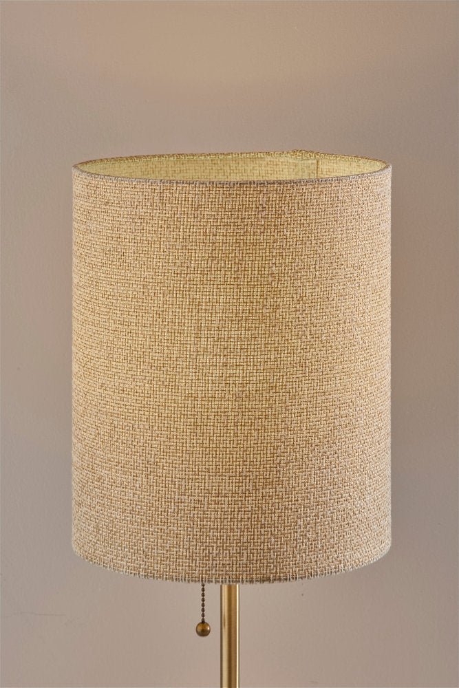 Detail view of 28" Black and Gold Marble and Metal Table Lamp With Beige Drum Shade, filling the frame with the beige metal texture.