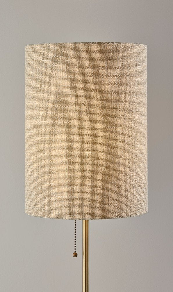 28" Black and Gold Marble and Metal Table Lamp With Beige Drum Shade close-up highlighting the beige metal surface.