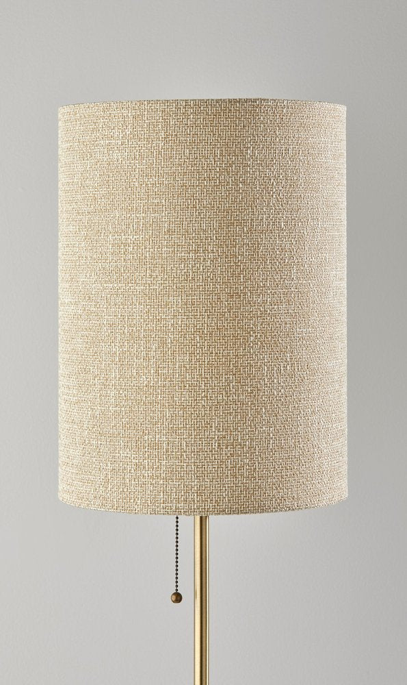 28" Black and Gold Marble and Metal Table Lamp With Beige Drum Shade. Table lamp isolated on a plain white background, showing a beige metal surface.
