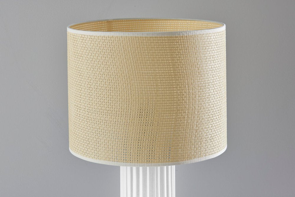 Detail view of 24" White Ceramic Cylinder Table Lamp With Beige Drum Shade, filling the frame with the beige ceramic texture.