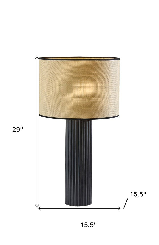 29" Black Ceramic Cylinder Table Lamp With Beige Drum Shade. Table lamp isolated on a plain white background, finished in beige ceramic.