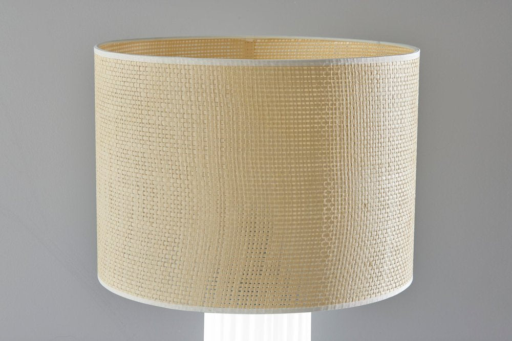 Detail view of 29" White Ceramic Cylinder Table Lamp With Beige Drum Shade, filling the frame with the beige ceramic texture.