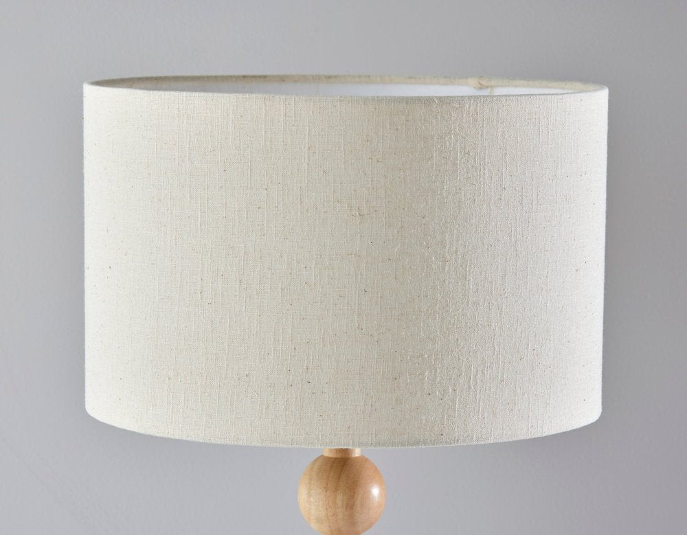 28" Brown Solid Wood Candlestick Table Lamp With Off White Drum Shade. Table lamp isolated on a plain white background, finished in off-white wood.