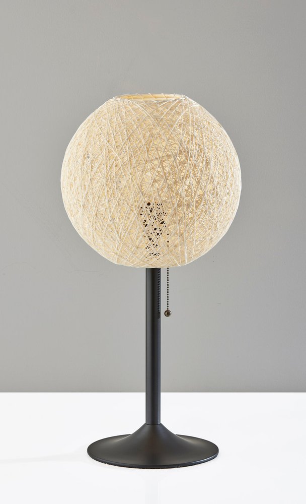 24" Antiqued Bronze Metal Candlestick Table Lamp With Off White Globe Shade. Table lamp isolated on a plain white background, showing a off-white metal surface.