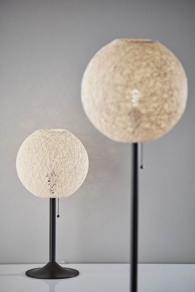 24" Antiqued Bronze Metal Candlestick Table Lamp With Off White Globe Shade. Table lamp in off-white metal.