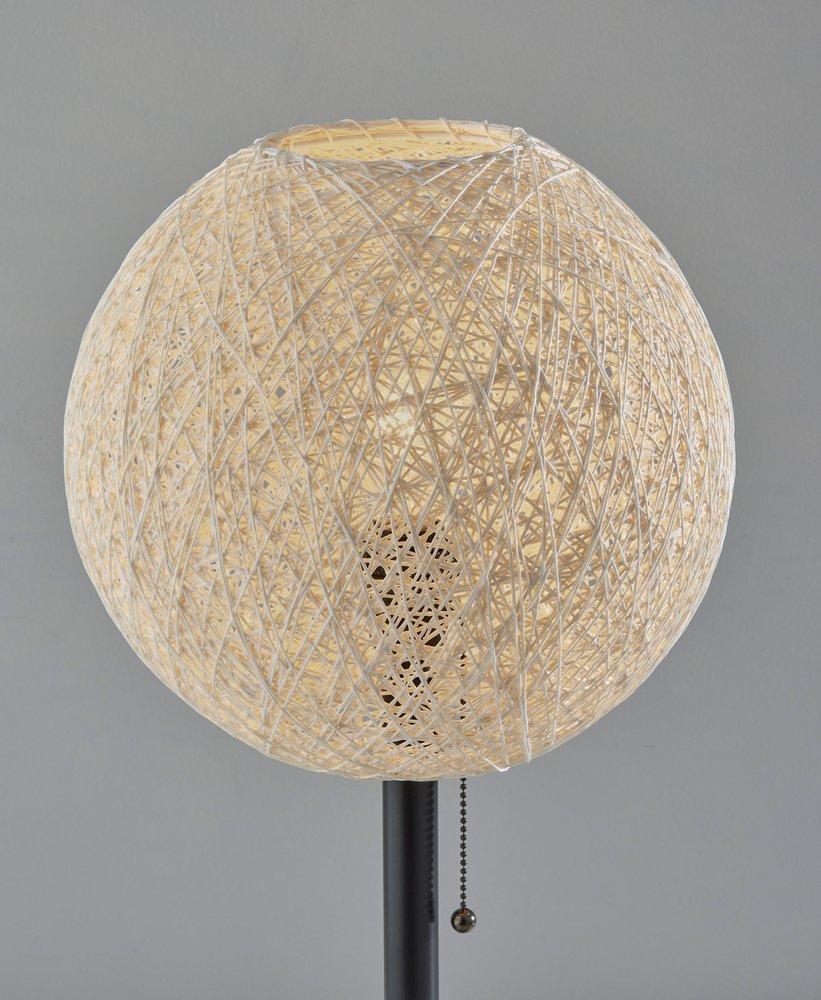 Detail view of 24" Antiqued Bronze Metal Candlestick Table Lamp With Off White Globe Shade, filling the frame with the off-white metal texture.