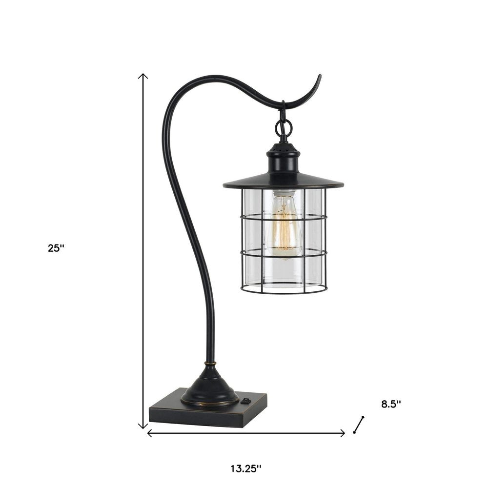 25" Bronze Metal Lantern Style Desk Lamp With Edison Bulb. Lamp isolated on a plain white background, showing a metal surface.