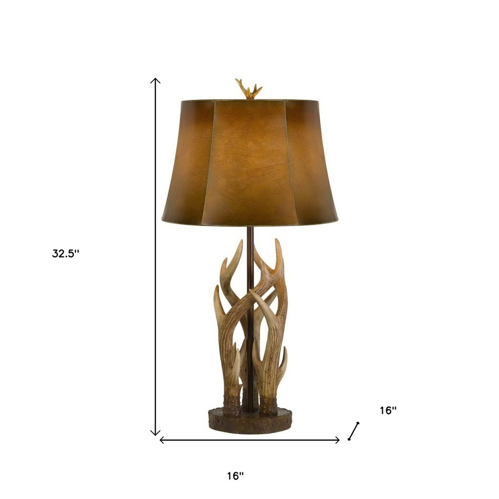 33" Brown Antlers Table Lamp With Brown Drum Shade. Table lamp isolated on a plain white background, showing its brown color.