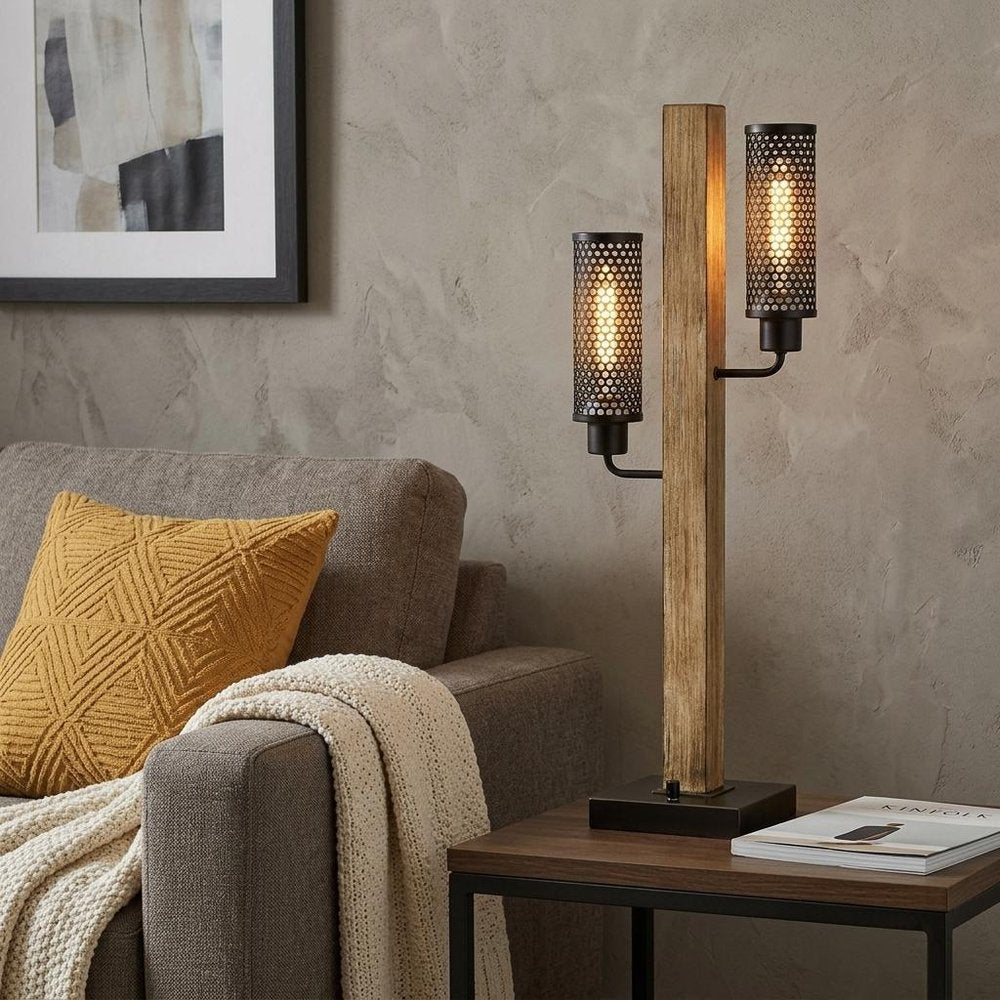 32" Gray Metal Two Light Table Lamp With Black Novelty Shade displayed on a dark wood tabletop in a furnished interior against a tan wall.