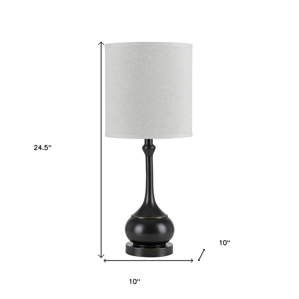25" Blackened Bronze Metal Round Table Lamp With Off White Drum Shade. Table lamp isolated on a plain white background, in a off-white metal finish.