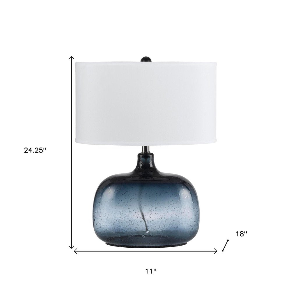 24" Dark Blue Glass Table Lamp With White Novelty Shade. Table lamp isolated on a plain white background, showing a white glass surface.
