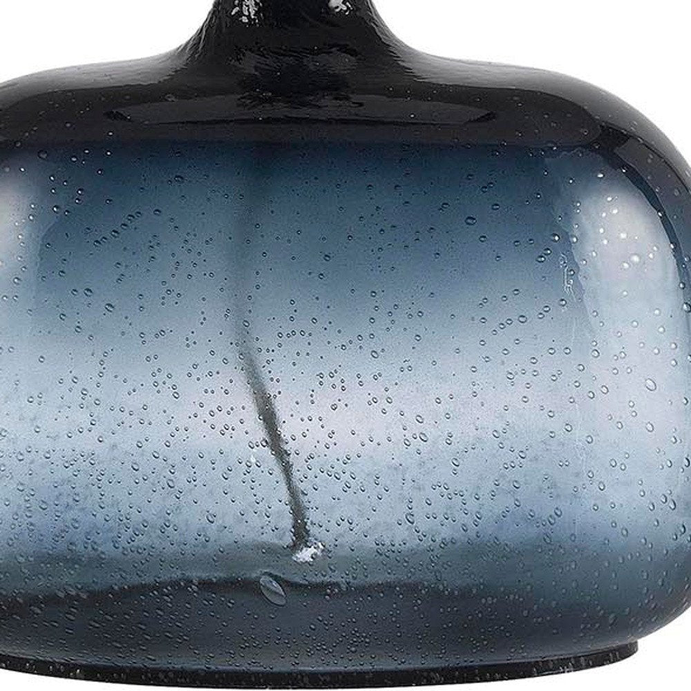 Close-up of 24" Dark Blue Glass Table Lamp With White Novelty Shade showing the blue glass texture.