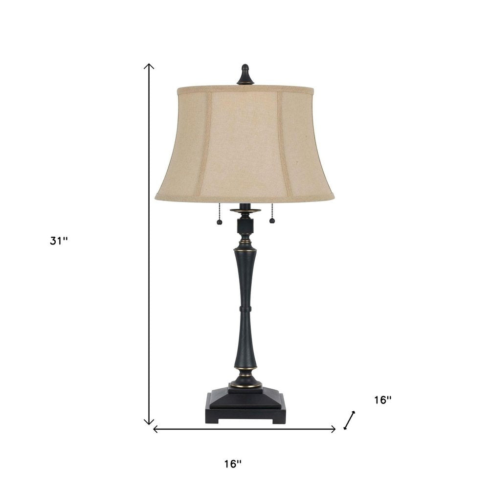 31" Black Metal Two Light Candlestick Table Lamp With Beige Empire Shade. Table lamp isolated on a plain white background, in a beige metal finish.