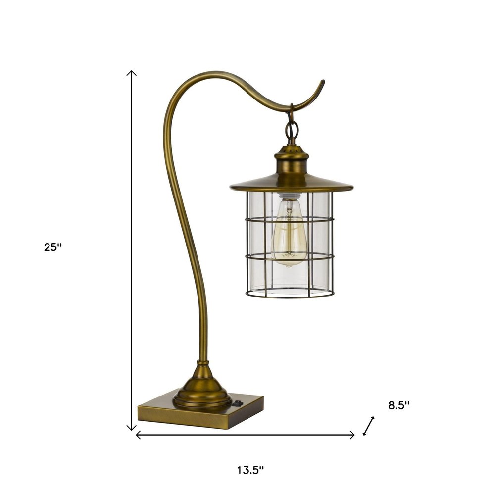 25" Antiqued Brass Metal Lantern Desk Lamp With Antiqued Brass Drum Shade. Lamp isolated on a plain white background, showing a metal surface.