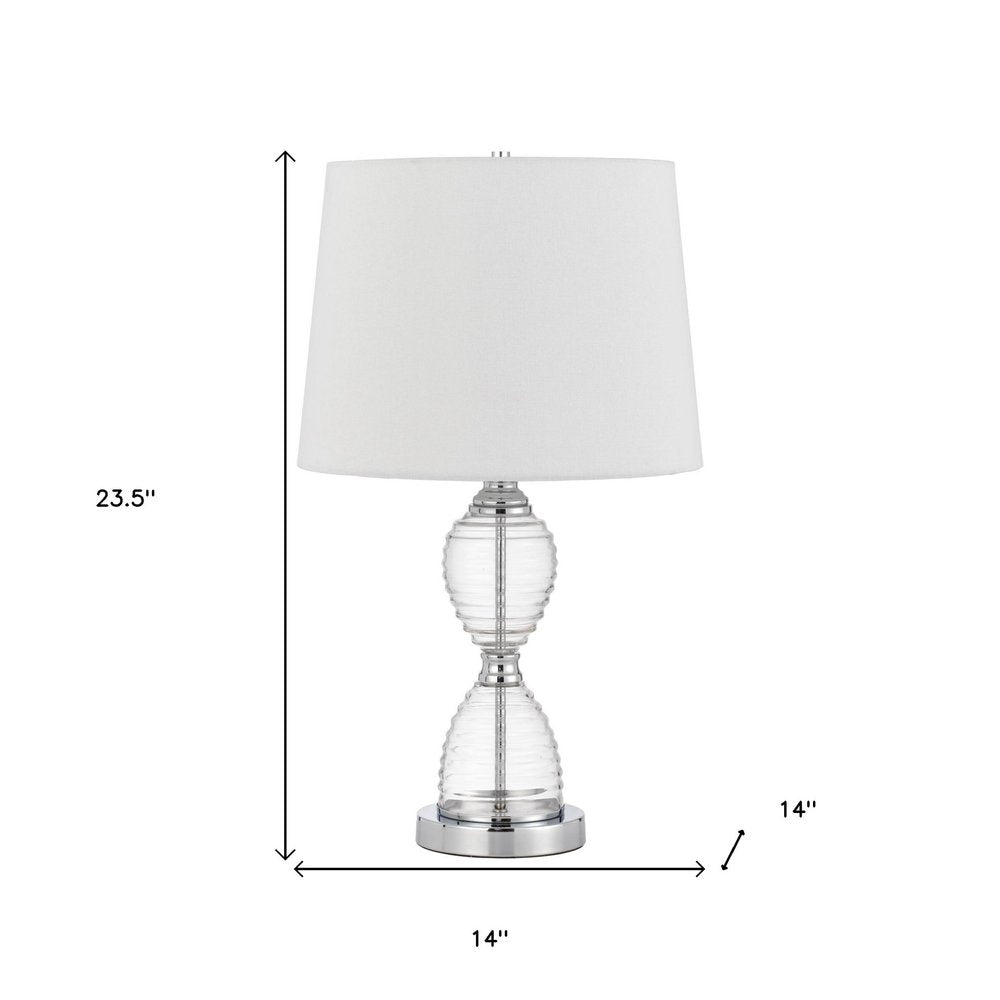 24" Clear Metal Table Lamp With White Empire Shade. Table lamp isolated on a plain white background, showing a white metal surface.