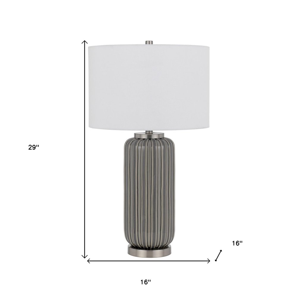 29" Gray Metal Cylinder Table Lamp With White Drum Shade. Table lamp isolated on a plain white background, finished in white metal.