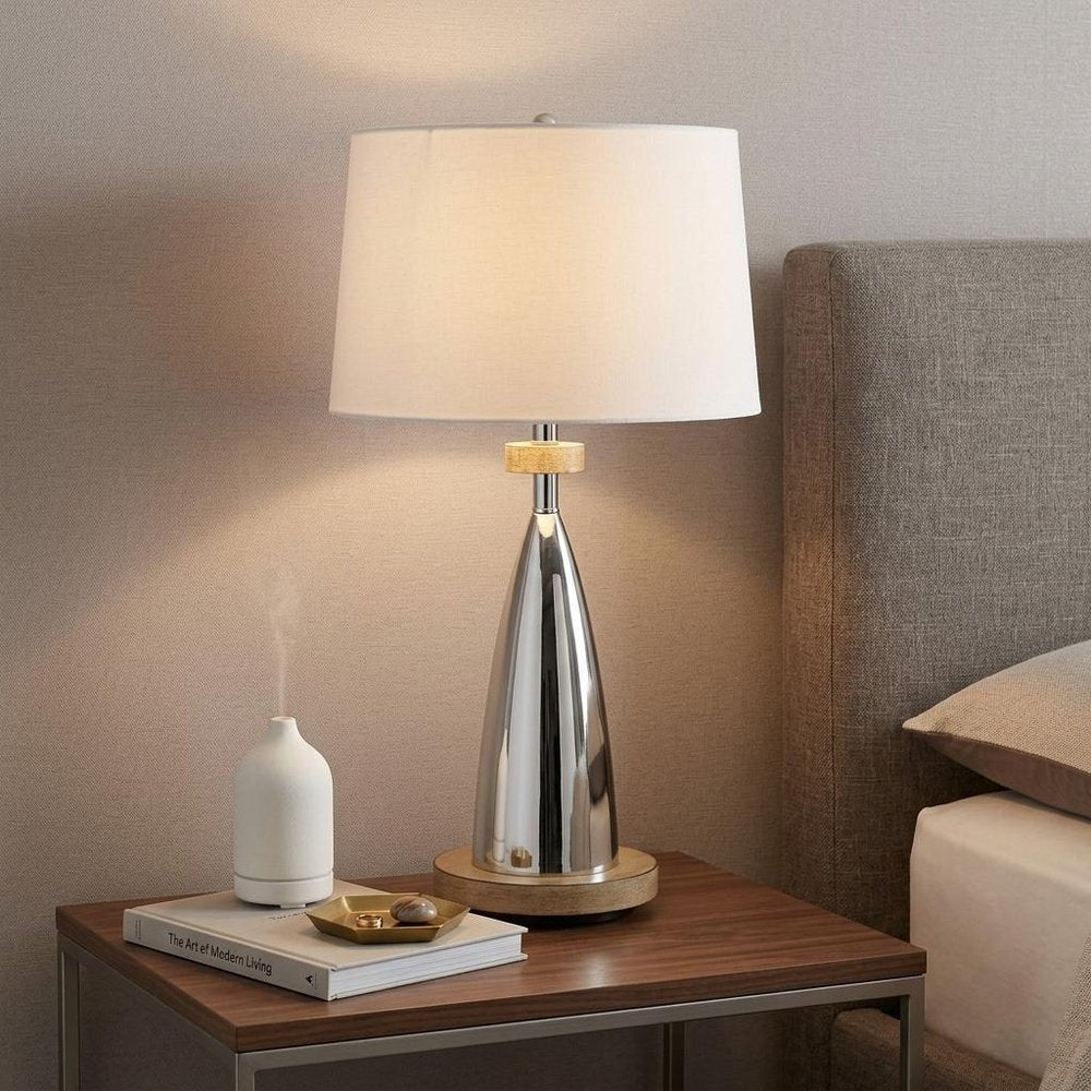 31" Brown Metal Geometric USB Table Lamp With White Empire Shade displayed on a dark wood tabletop in a furnished interior against a tan wall.