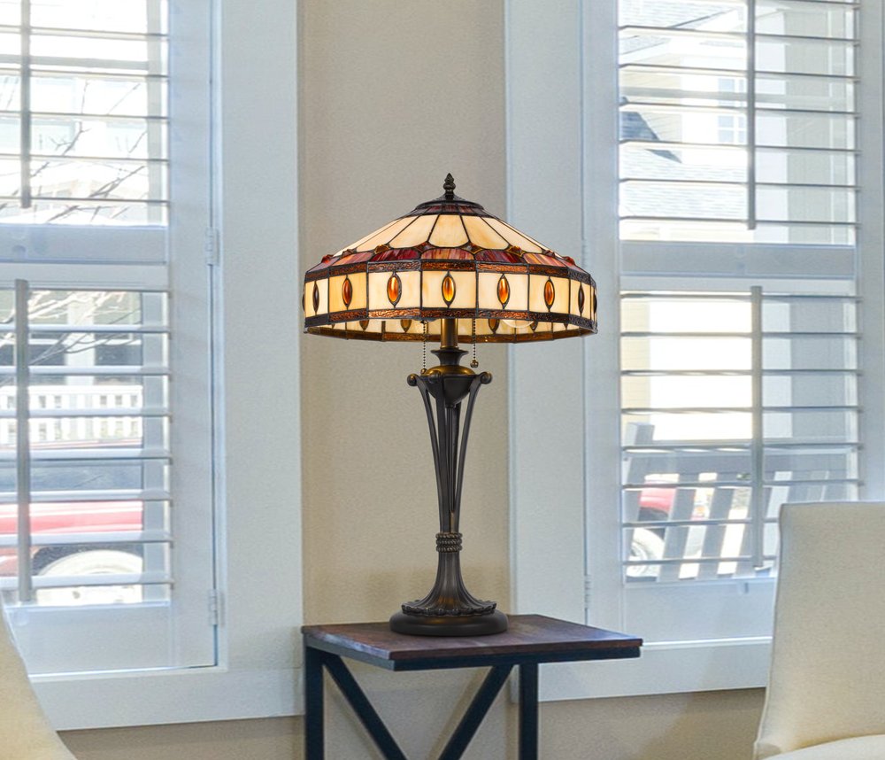 26" Black Metal Two Light Candlestick Table Lamp With Ivory and Red Dome Shade. Table lamp isolated on a plain white background, showing a metal surface.