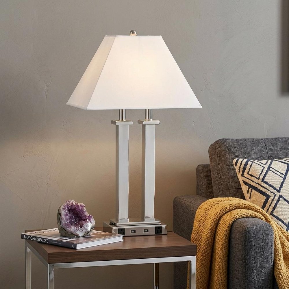 26" Nickel Metal Two Light Desk USB Table Lamp With White Novelty Shade displayed on a dark wood tabletop in a furnished interior against a tan wall in silver metal.