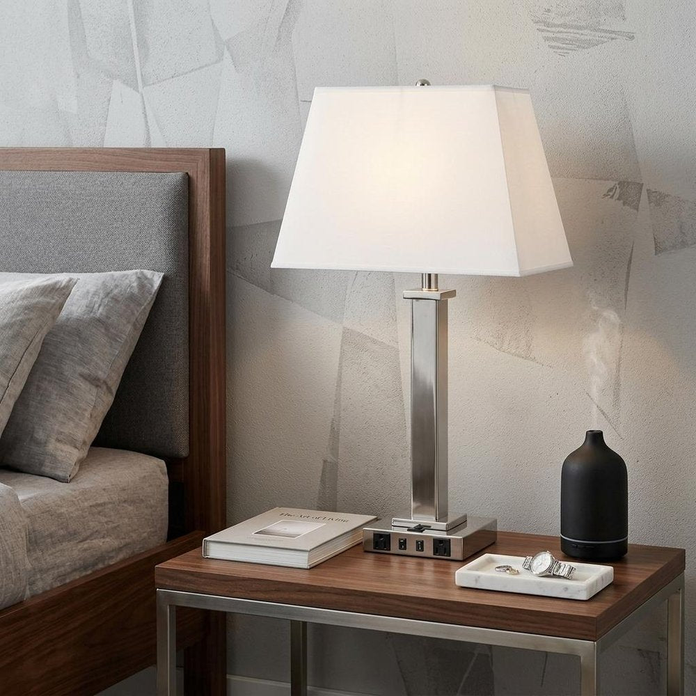 28" Nickel Metal USB Table Lamp With White Shade displayed on a tabletop in a furnished interior against a light gray wall in silver metal.