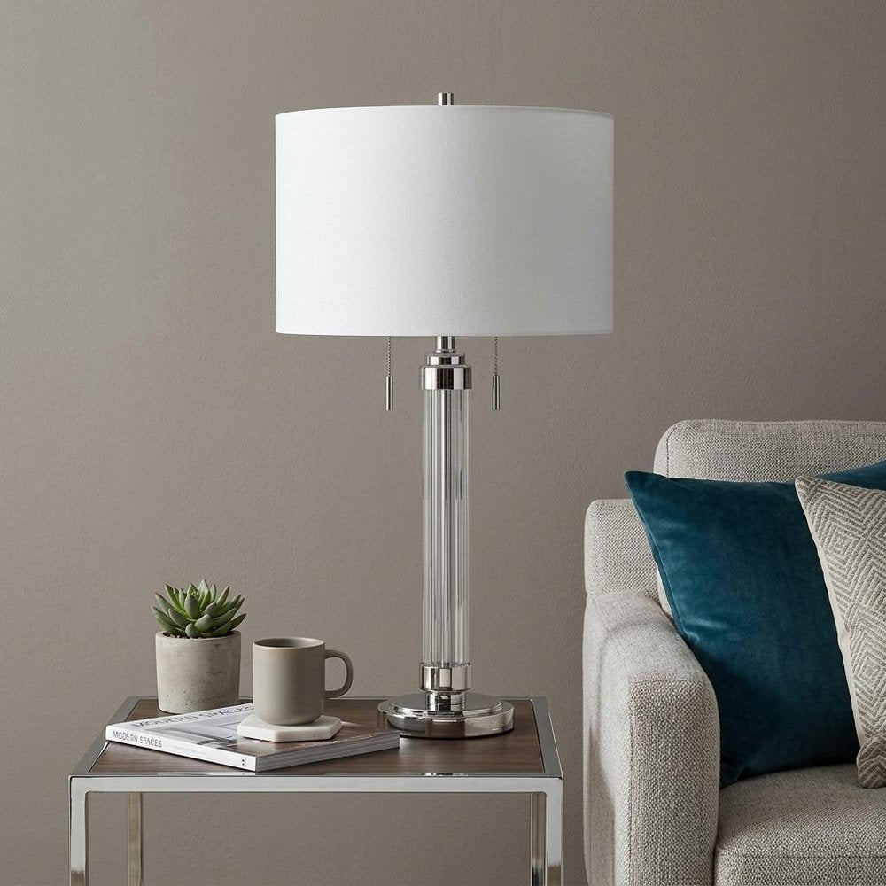 31" Silver Metallic Metal Two Light Cylinder Table Lamp With White Drum Shade. Table lamp in silver metal.