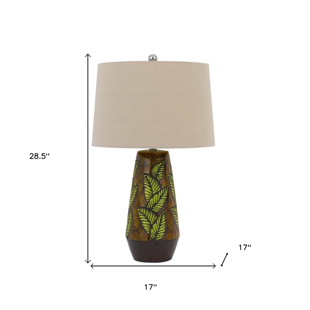 29" Brown Ceramic Cylinder Table Lamp With Tan Empire Shade. Table lamp isolated on a plain white background, finished in brown ceramic.