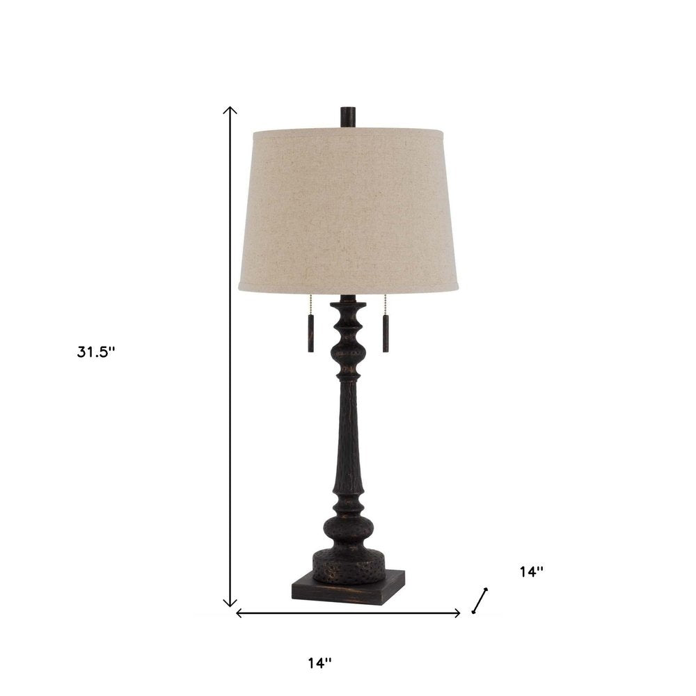 32" Charcoal Two Light Table Lamp With Tan Drum Shade. Table lamp isolated on a plain white background.
